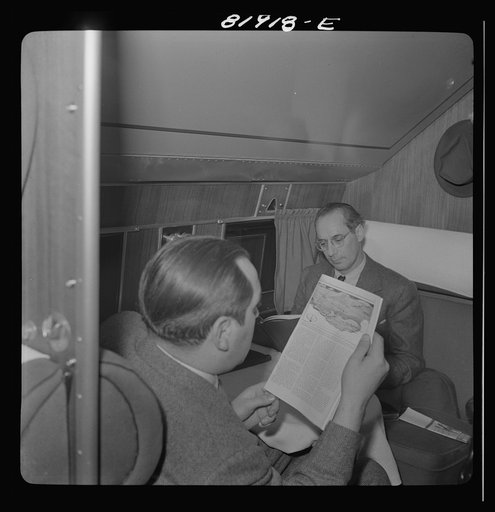 Untitled photo, possibly related to: Passengers aboard an American airliner enroute from Washington to Los Angeles