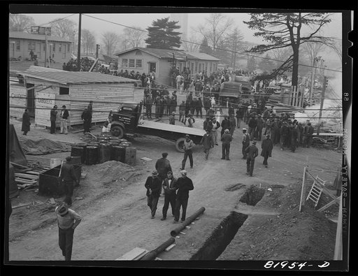 Untitled photo, possibly related to: Eight o'clock whistle, construction gang starting to work on emergency office space, Washington, D.C.