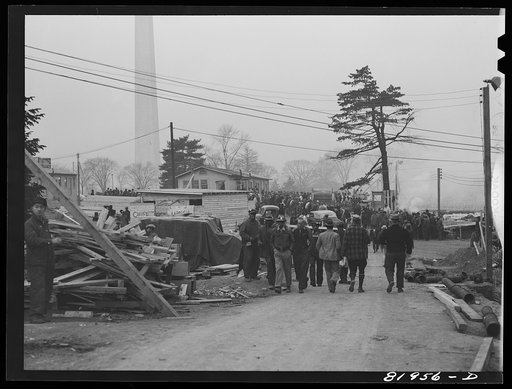 Untitled photo, possibly related to: Eight o'clock whistle, construction gang starting to work on emergency office space, Washington, D.C