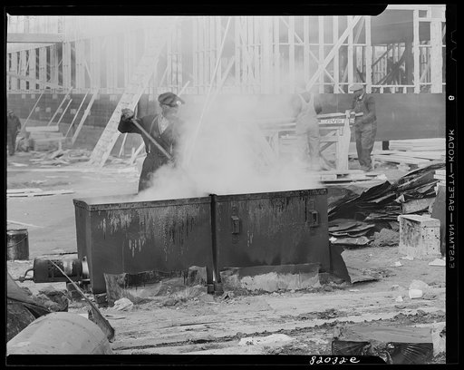 Untitled photo, possibly related to: Melting tar for roofing on emergency defense office construction job. Washington, D.C.