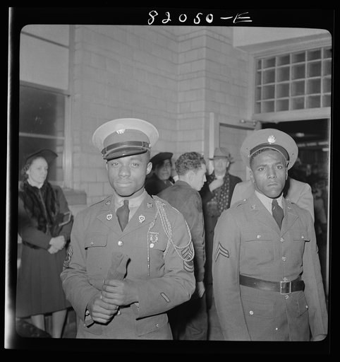 Washington, D.C. Christmas rush in the Greyhound bus terminal. Negro soldiers waiting for a bus