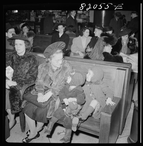 Washington, D.C. Christmas rush in the Greyhound bus terminal. Mother and children waiting for a bus