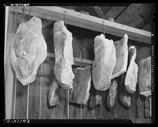 Cured pork hanging in the meat house of a Negro FSA (Farm Security Administration) client at Calvert County, Maryland