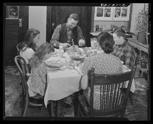 FSA (Farm Security Administration) client and family sitting down to a well "balanced meal." Calvert County, Maryland