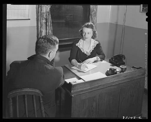 Washington, D.C. Self-help client being interviewed by self-help exchange secretary and Junior League voluntary worker