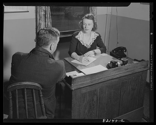 Untitled photo, possibly related to: Washington, D.C. Self-help client being interviewed by self-help exchange secretary and Junior League voluntary worker