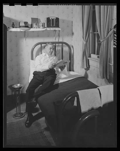 Untitled photo, possibly related to: Washington, D.C. Self-help client in his room in self-help house, where he pays for his room with scrip earned as timekeeper in the self-help exchange