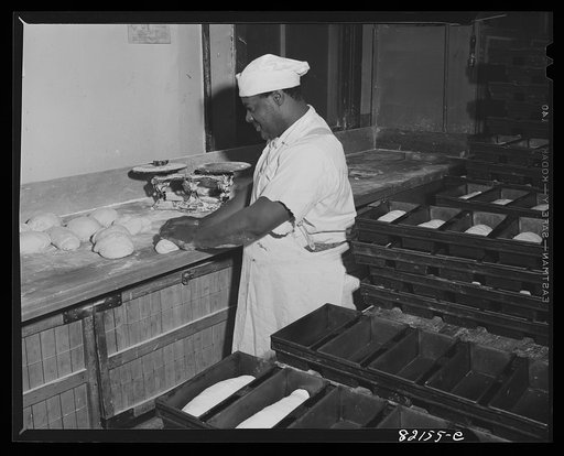 Washington, D.C. Baker preparing dough in self-help kitchen