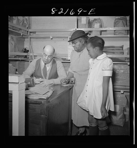 Washington, D.C. This girl's grandmother has just bought her a new dress with scrip at the self-help exchange