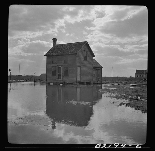 Dorchester County, Maryland. High tide sweeps under the floor of this "waterman's" home on Gibson Island
