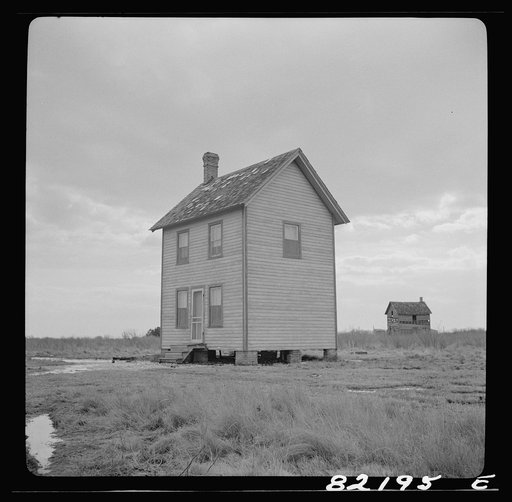 Dorchester County, Maryland. High tide sweeps under the floor of this "waterman's" home on Gibson Island