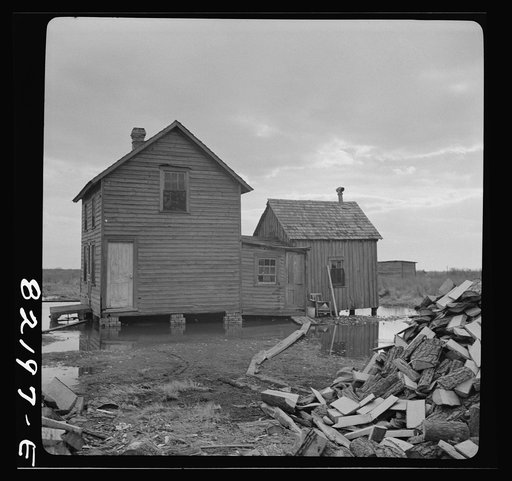 Dorchester County, Maryland. High tide sweeps under the floor of this "waterman's" home on Gibson Island