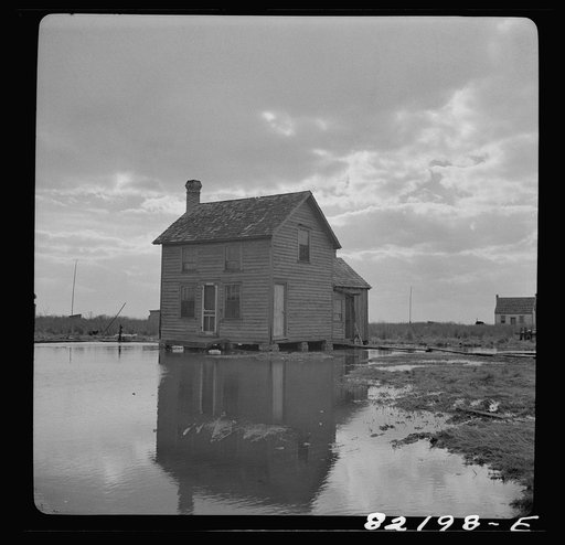 Dorchester County, Maryland. High tide sweeps under the floor of this "waterman's" home on Gibson Island