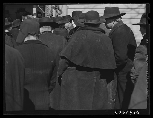 Lancaster County, Pennsylvania. Mennonite farmers drove in from the surrounding countryside in their black buggies to gossip and buy a needed piece of equipment for the coming year at a farm auction