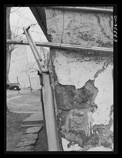 Bucks County, Pennsylvania. Fair-lead supporting wire running from waterwheel to pump