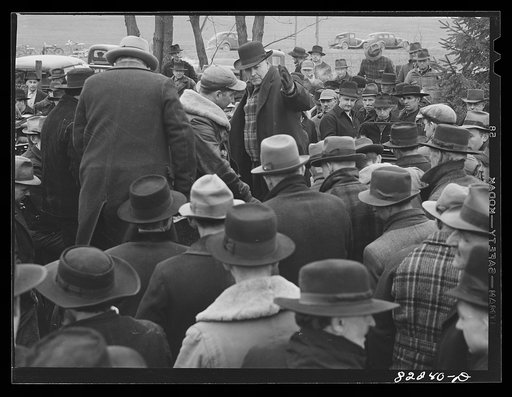 Untitled photo, possibly related to: Lancaster County, Pennsylvania. Auctioneer starts bids on machinery