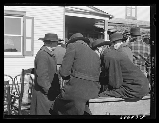 Lancaster County, Pennsylvania. Mennonite farmers gossiping at farm auction