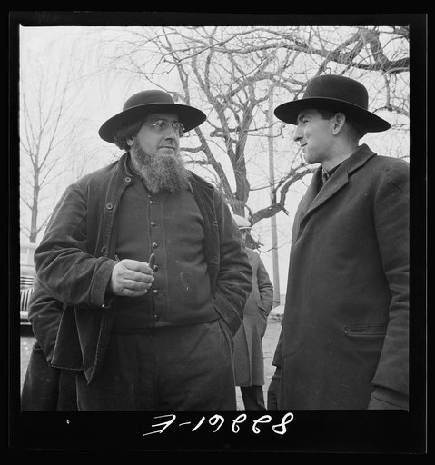 Lancaster County, Pennsylvania. Amish men attending farm auction