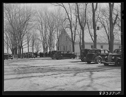 Blue Ball, Pennsylvania (vicinity). Progressive order of Mennonite, known as the "Car Mennonites," coming out of Sunday service. They use cars, but usually paint all nickel trim black