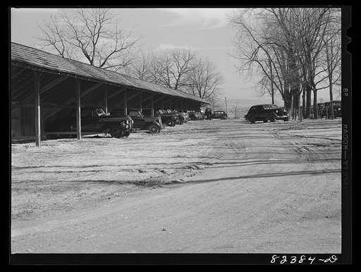 Blue Ball, Pennsylvania (vicinity). "Car Mennonites" park their black painted automobiles where, the following Sunday, the "horse Mennonites" will stand their carriages