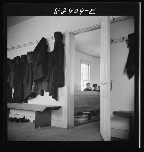 Untitled photo, possibly related to: Hinkletown, Pennsylvania (vicinity). Girls' cloaks and bonnets hanging in church during "Deutsch school"