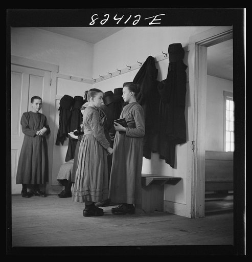 Untitled photo, possibly related to: Hinkletown, Pennsylvania (vicinity). Mennonite girls waiting for "Deutsch school" to begin in Mennonite church