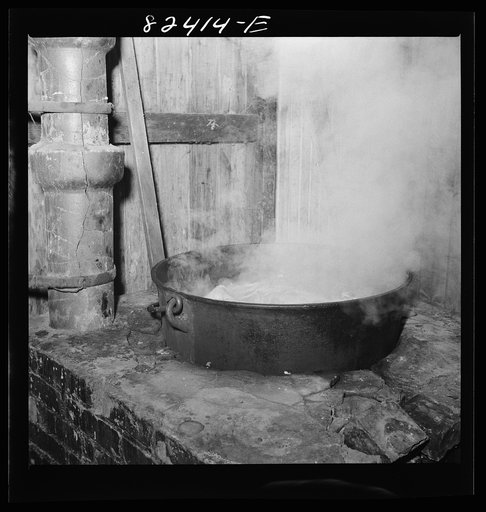 Honey Brook, Pennsylvania (vicinity). Boiling down meat scraps which remain from butchering on an Amish farm
