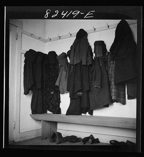 Hinkletown, Pennsylvania (vicinity). Girl's cloaks and bonnets hanging in church during "Deutsch school"