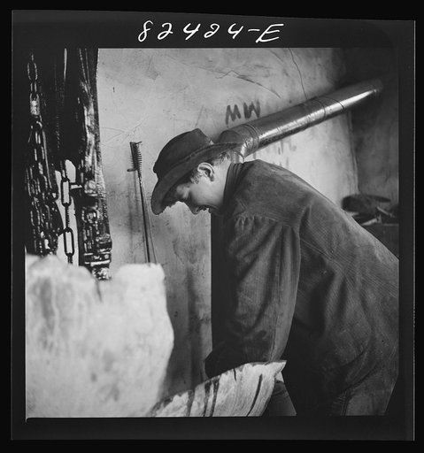 Untitled photo, possibly related to: Honey Brook, Pennsylvania (vicinity). Amish farmland dipping harness in oil on the Zook farm