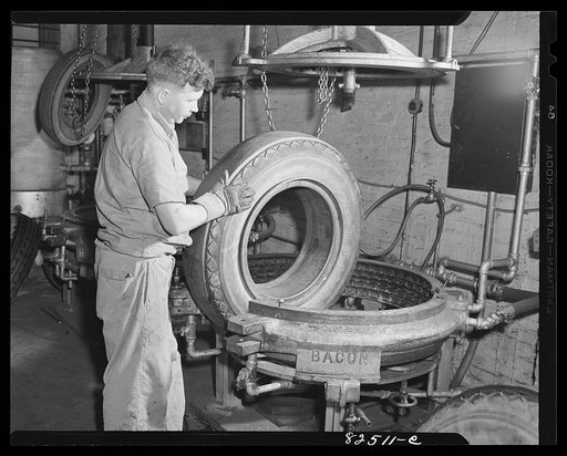 Washington, D.C. Tire with recap glued in place, ready to go in vulcanizing mould in tire retreading shop