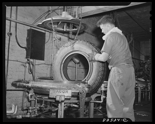Wahington, D.C. Washington tire shop. Removing truck from vulcanizing mould after "cooking" for three hours