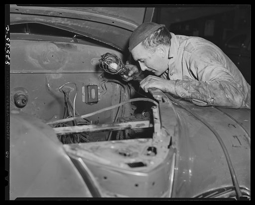 Washington, D.C. Mechanic working on an engine