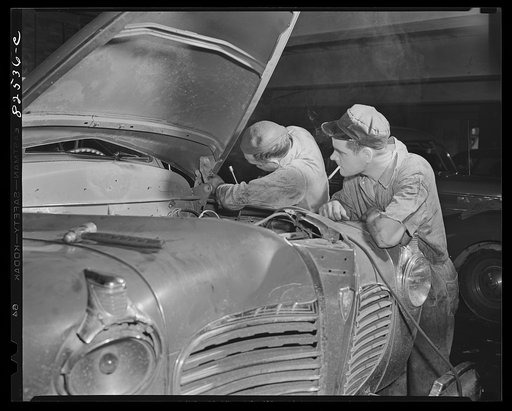 Washington, D.C. Mechanic working on an engine