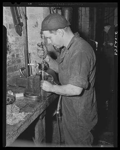 Washington, D.C. Mechanic working on an engine part