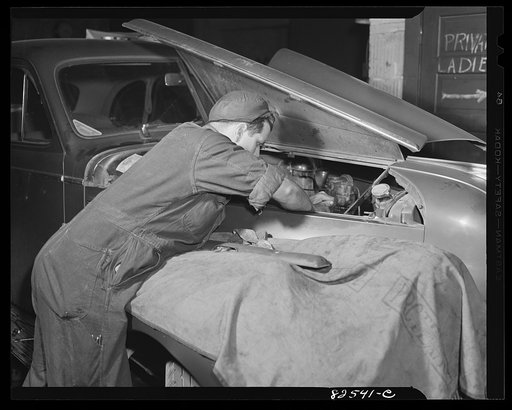 Washington, D.C. Mechanic working on an engine