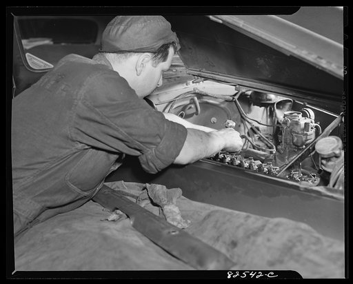 Washington, D.C. Mechanic working on an engine