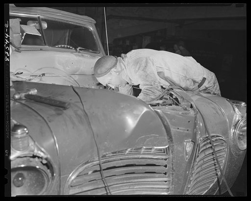 Washington, D.C. Mechanic working on an engine