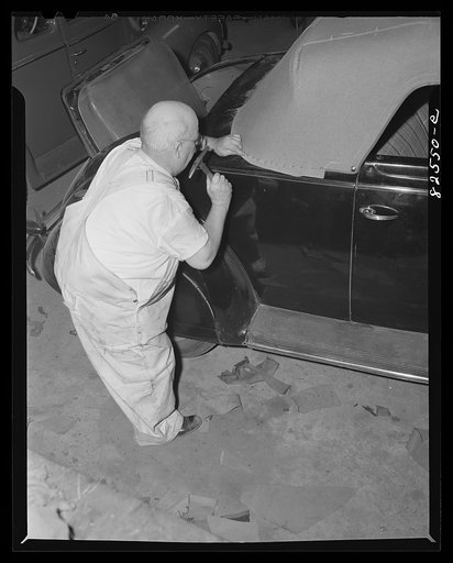 Arlington, Virginia. Tacking down a new top on a second hand car