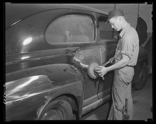 Arlington, Virginia. Buffing surface of a car body prior to painting