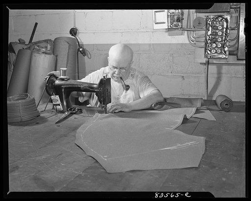Arlington, Virginia. Auto refinishing plant. Skilled craftsman who learned his trade in the horse and buggy days has all the work he can attend to