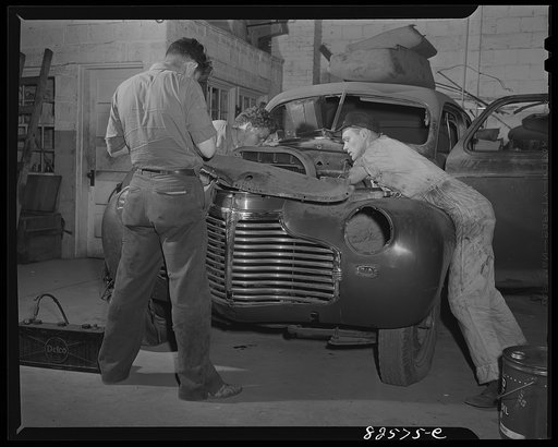 Arlington, Virginia. Mechanic diagnosing engine trouble