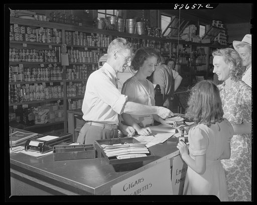 Escambia Farms, Florida. Making change in the cooperative store