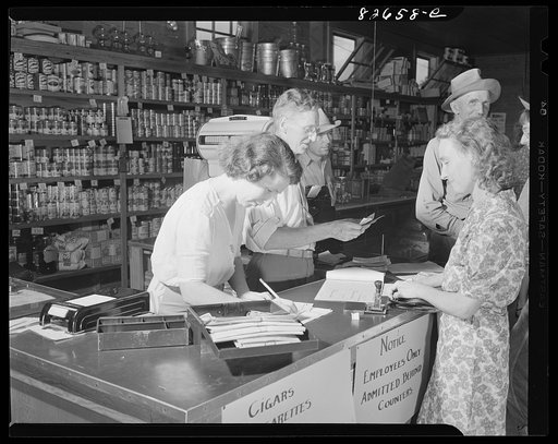 Escambia Farms, Florida. Making change in the cooperative store