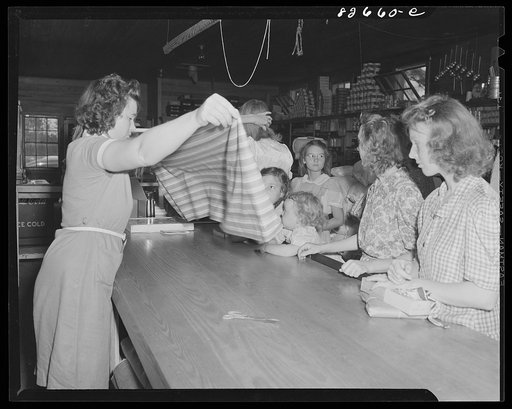 Escambia Farms, Florida. Selling yard goods in the cooperative store