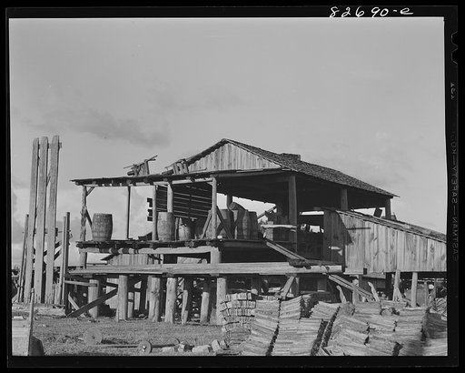 Untitled photo, possibly related to: Baker, Florida. The turpentine forests are about gone, but this mill on the edge of Baker still distills the gum