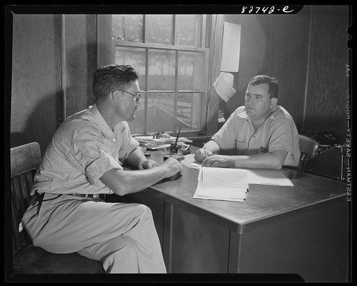 Escambia Farms, Florida. Mr. McClelland talking with the supervisor of the farms