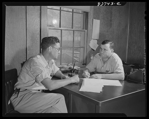 Untitled photo, possibly related to: Escambia Farms, Florida. Mr. McClelland talking with the supervisor of the farms