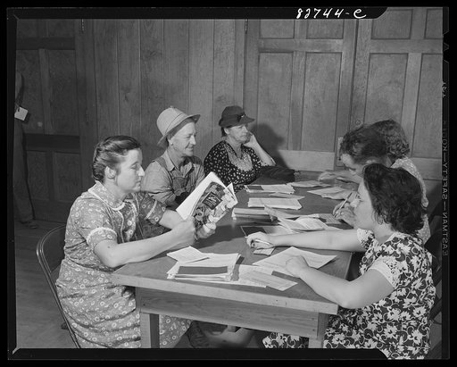 Escambia Farms, Florida. Mrs. McLelland talks over her canning problem with a FSA (Farm Security Administration) representative at the sugar ration board