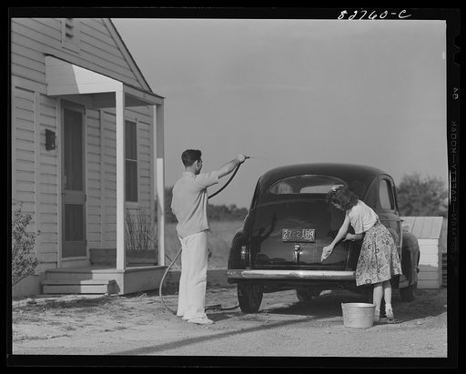 Childersburg, Alabama. Cousa Court defense housing project. Dupont powder plant defense worker, Albert Forest Smith, JR., and his wife, Fay Saunders Smith, look forward to using their car for the duration of the war, by slow driving and constant care