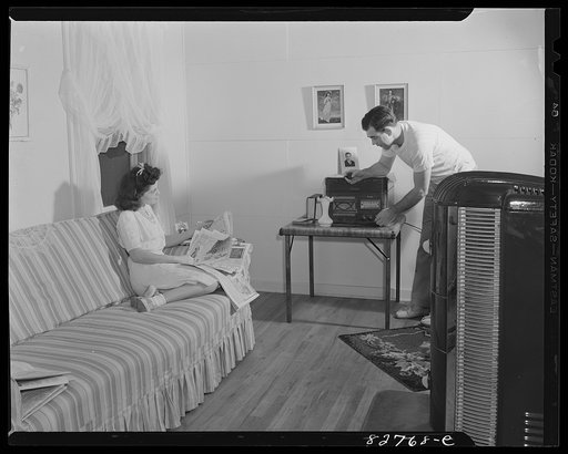 Childersburg, Alabama. Cousa Court defense housing project. The Smiths follow the news over their radio